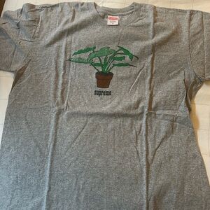 Supreme gray tee shirt with plant